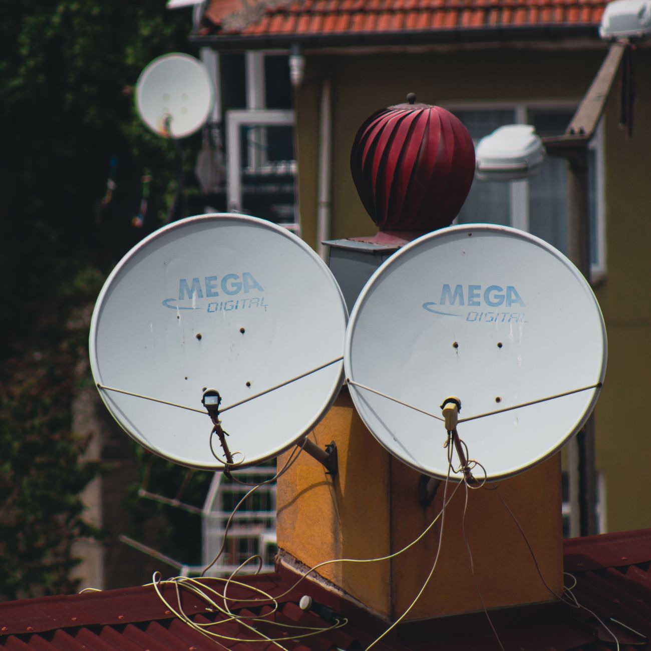 Satellite dishes mounted outside a building